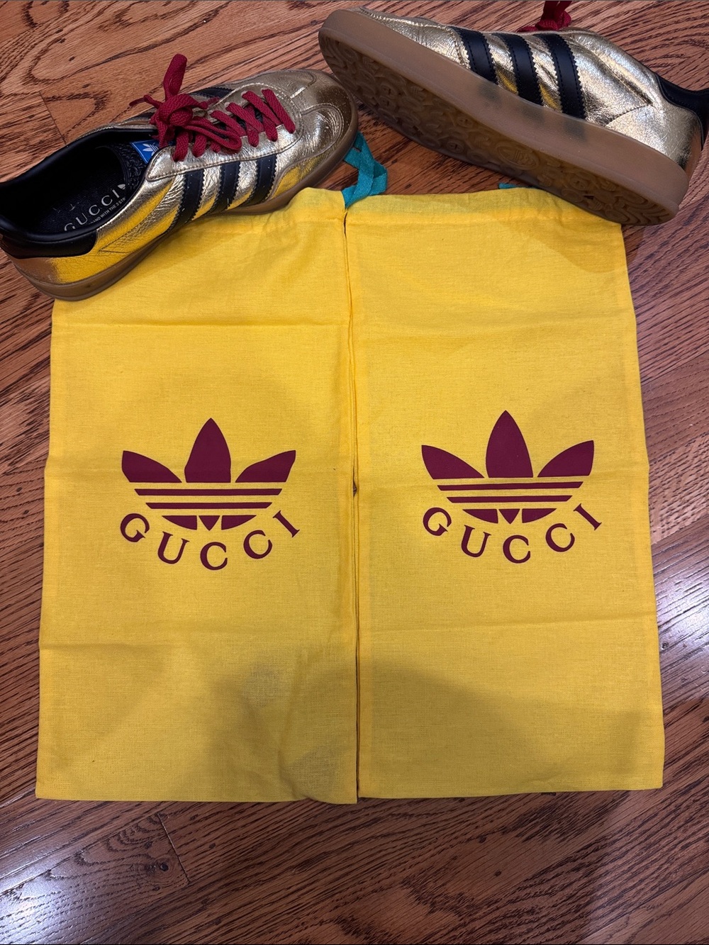 Gucci Metallic Gold Sneakers with Black Stripes and Red Laces